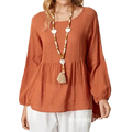 A soft rust-colored cotton linen long sleeve loose blouse with a relaxed fit and gathered waist