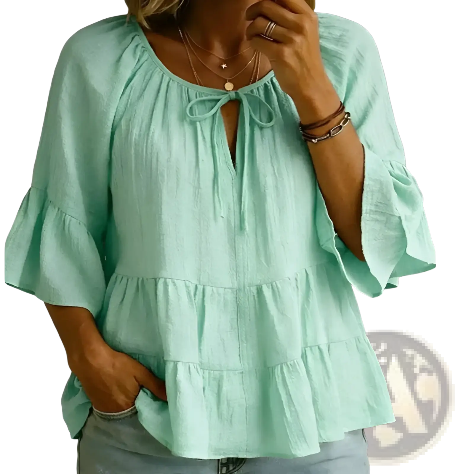 Mint green cotton linen pleated blouse top with tiered design, ruffled sleeves, and tie-front neckline