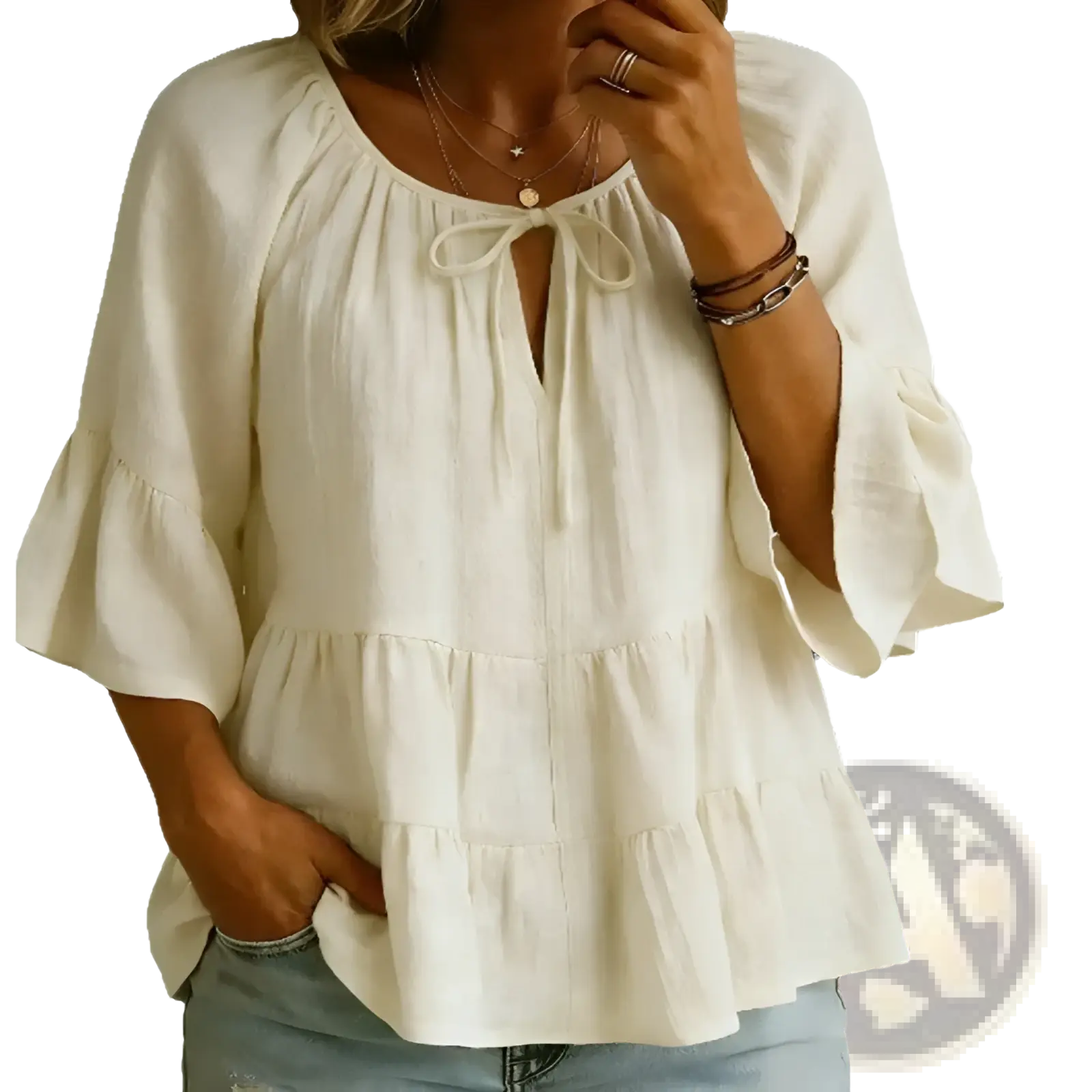 Cream-colored cotton linen blouse top with lightweight fabric, tie-front neckline, and ruffled three-quarter sleeves