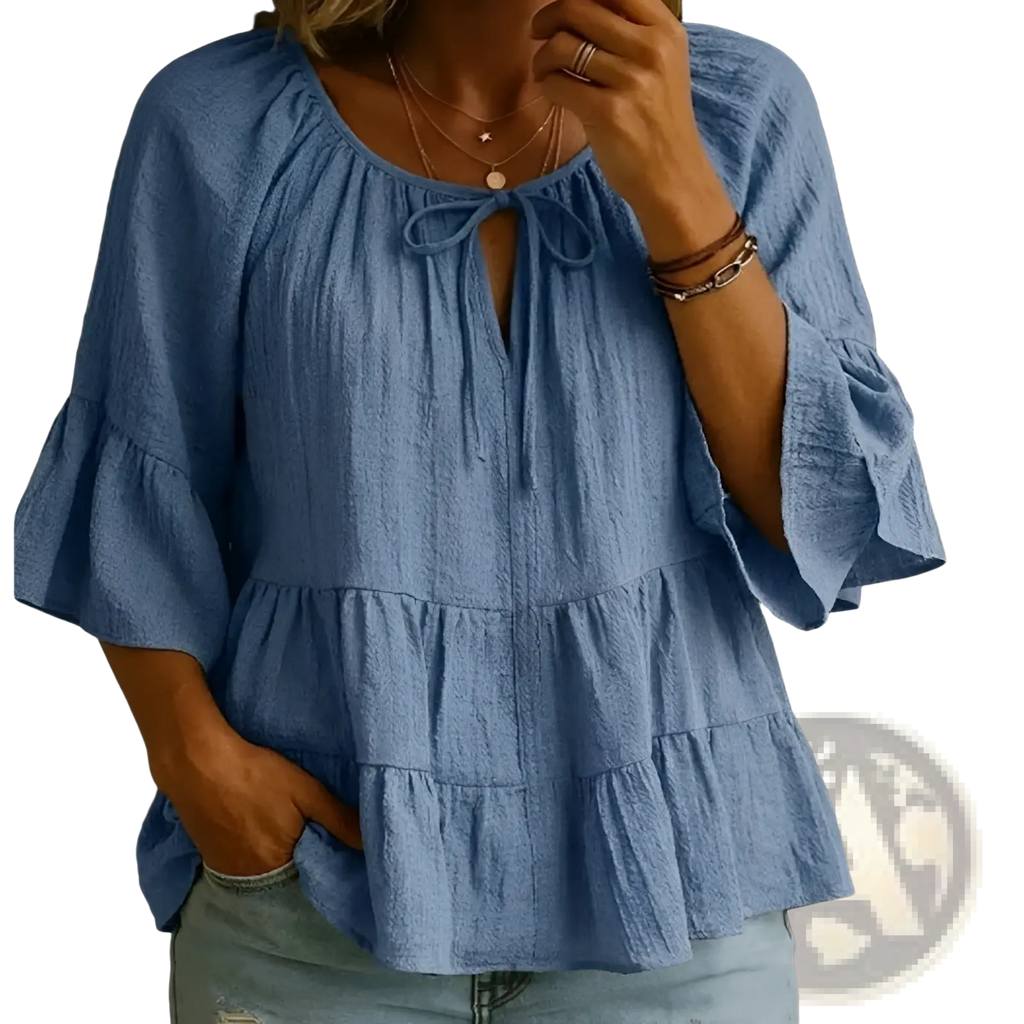 Light blue textured cotton linen pleated blouse top with ruffled sleeves and tiered hem for casual wear