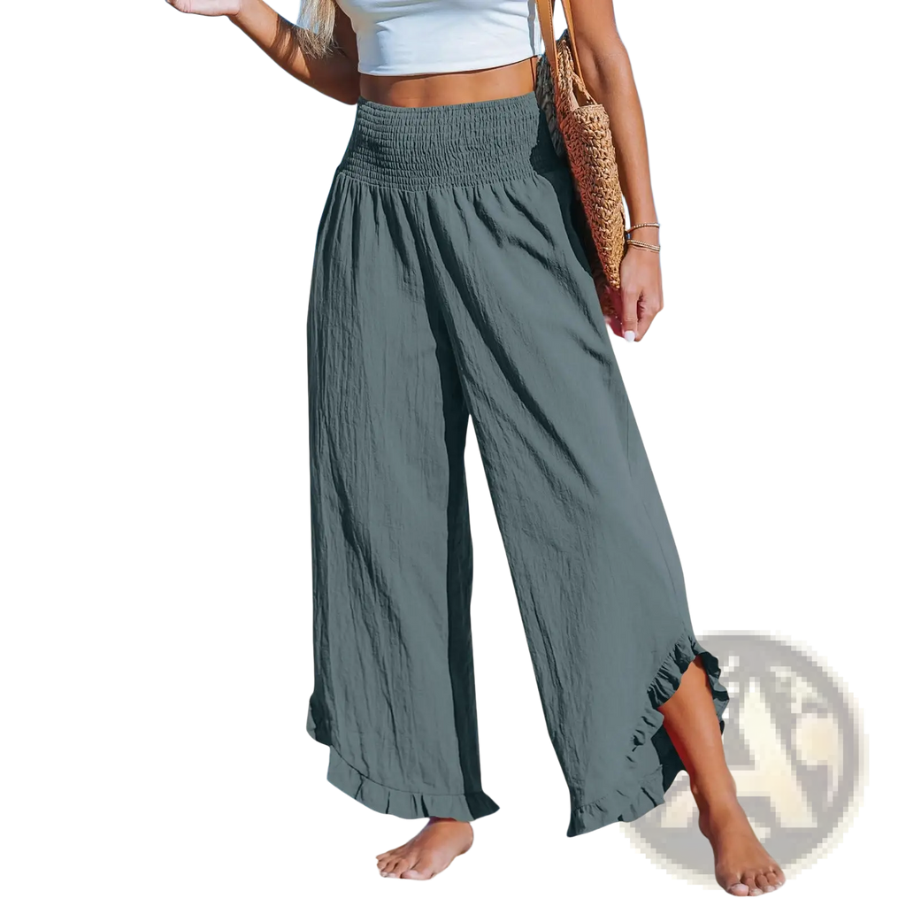 A pair of cotton linen ruffled harem pants in olive green with wide legs smocked waistband and ruffled hem