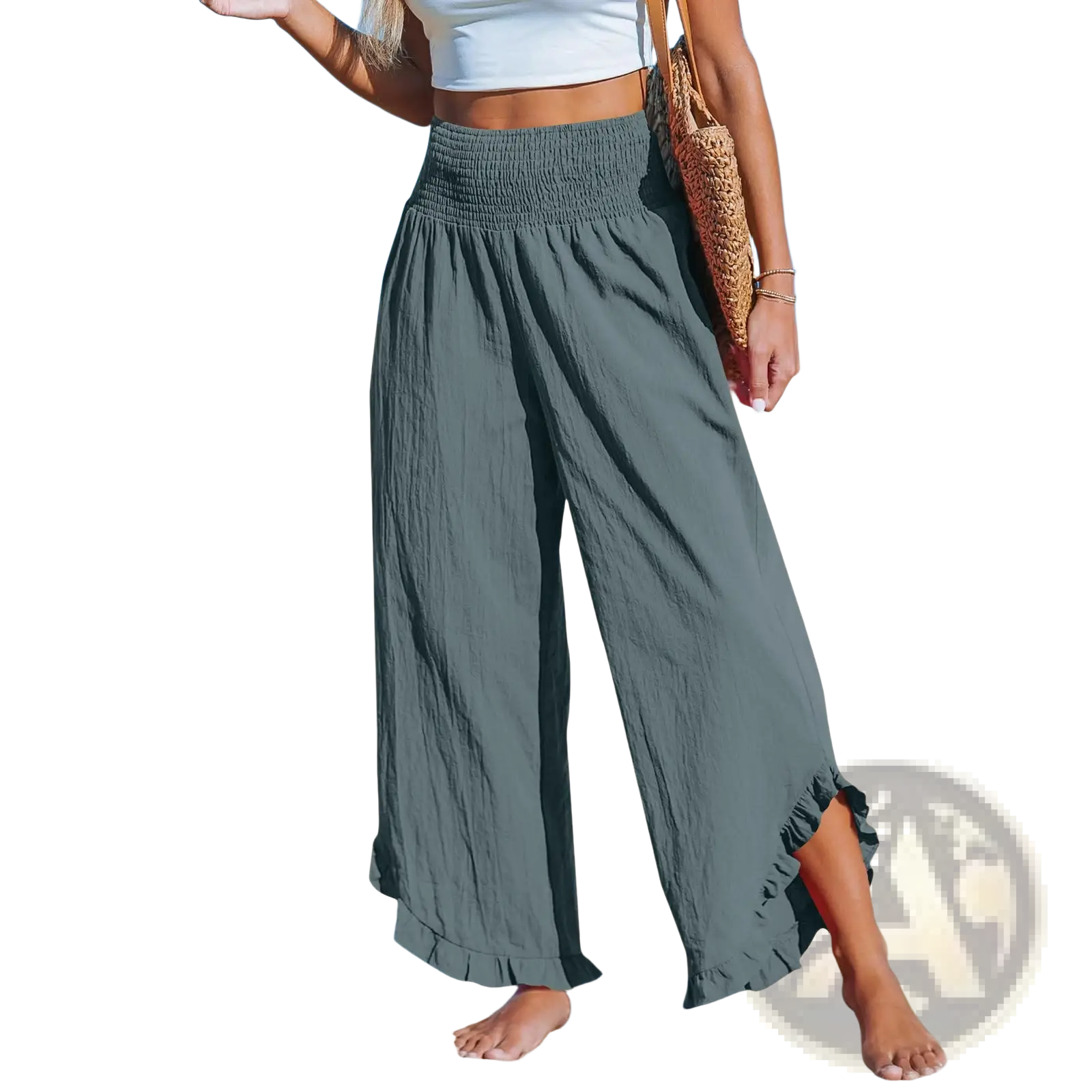 A pair of cotton linen ruffled harem pants in olive green with wide legs smocked waistband and ruffled hem