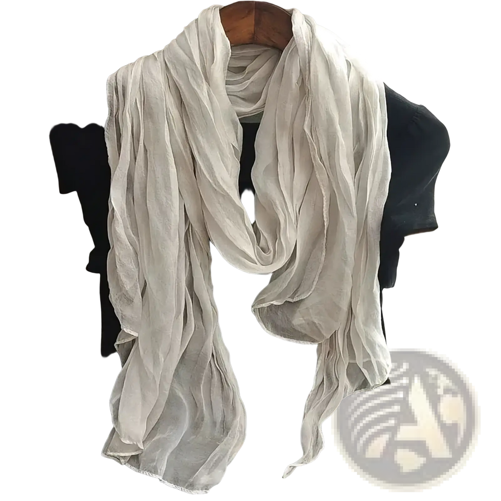 A delicate off-white cotton linen scarf for women draped elegantly over a black top showcasing its breathable fabric