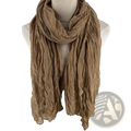 A soft crinkled tan cotton linen scarf for women draped elegantly as a breathable solid color shawl