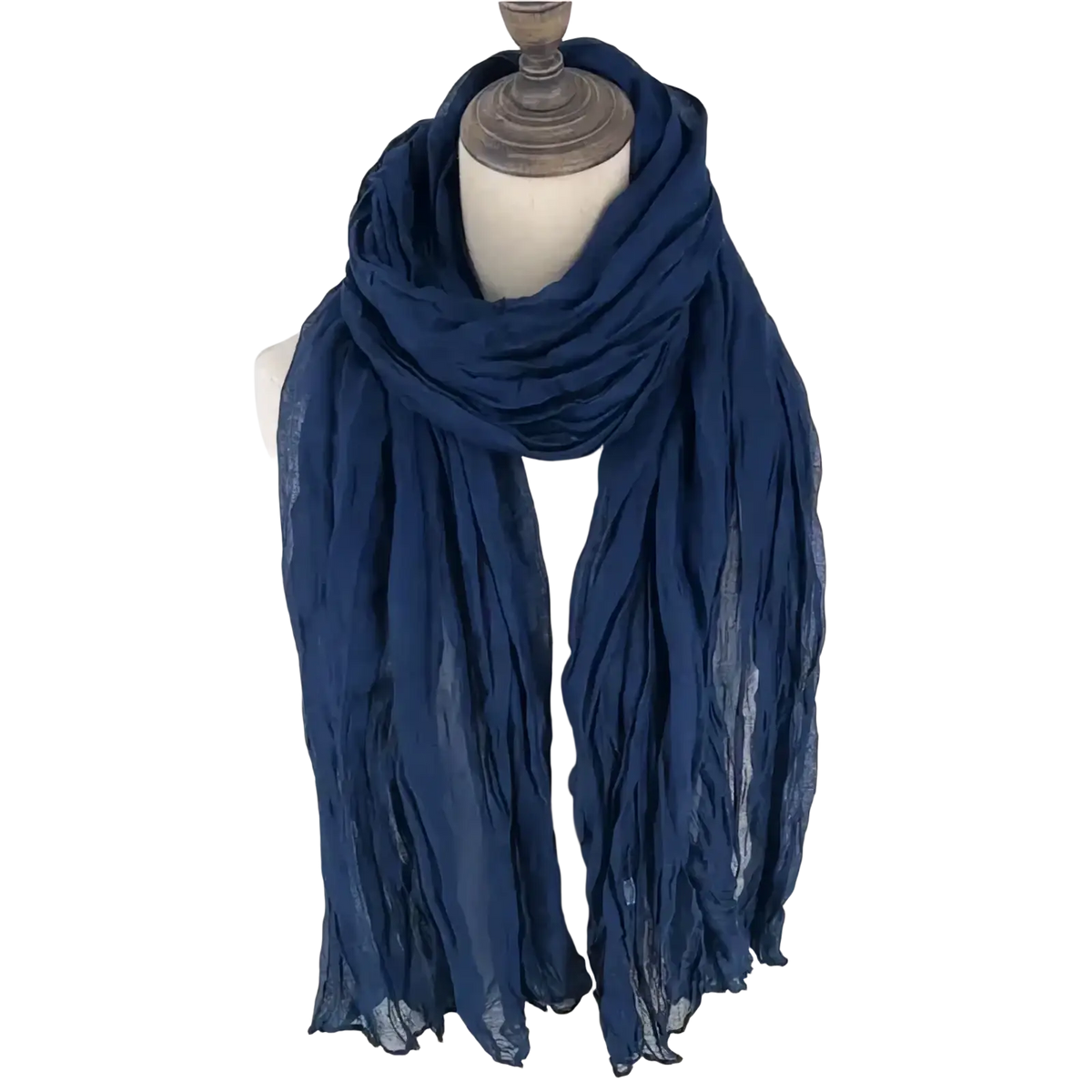 A navy blue lightweight crinkled cotton linen scarf for women draped around a mannequin neck