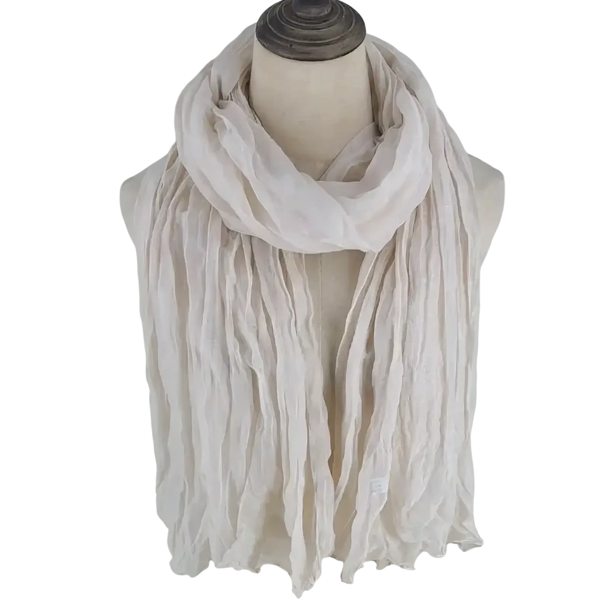 A soft off-white cotton linen scarf with textured crinkled fabric draped around a mannequin’s neck