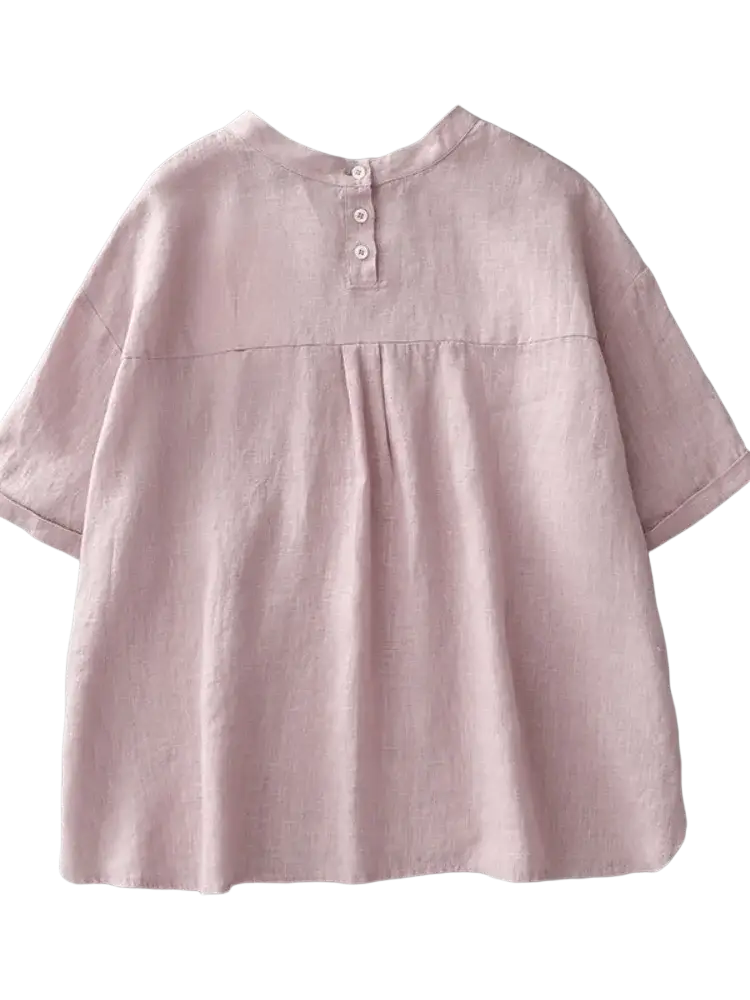 Soft blush pink cotton linen short sleeve top with loose fit and three buttons at the back neckline in linen material