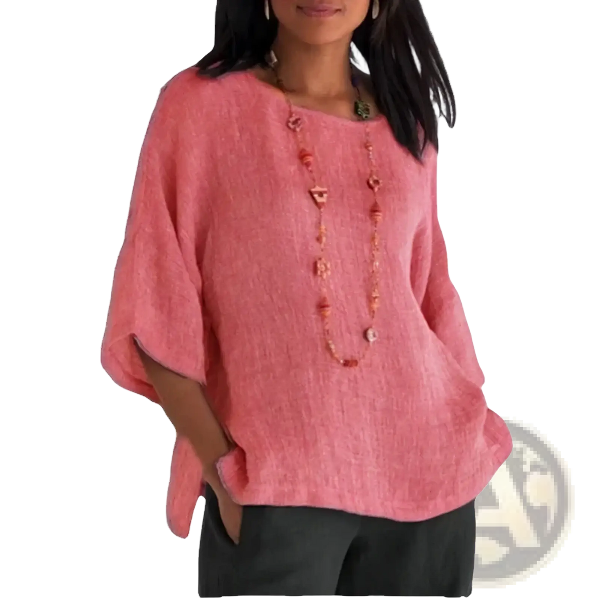 A soft pink cotton linen three quarter sleeve blouse with textured fabric and loose wide sleeves