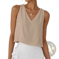 Beige cotton linen sleeveless top with v-neckline and relaxed flowing fabric for comfortable wear