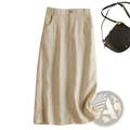 A light beige cotton linen vintage midi skirt with subtle vertical pleats high waist and side pockets made of soft fabric