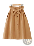 A tan cotton midi skirt with high waist gathered waistband and matching fabric bow tied at the front for casual wear