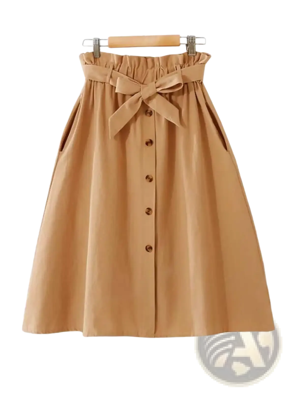 A tan cotton midi skirt with high waist gathered waistband and matching fabric bow tied at the front for casual wear