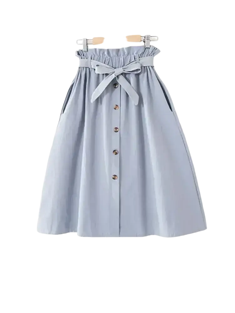 Light blue cotton midi skirt with high waist gathered waistband, brown buttons, and matching fabric bow tie
