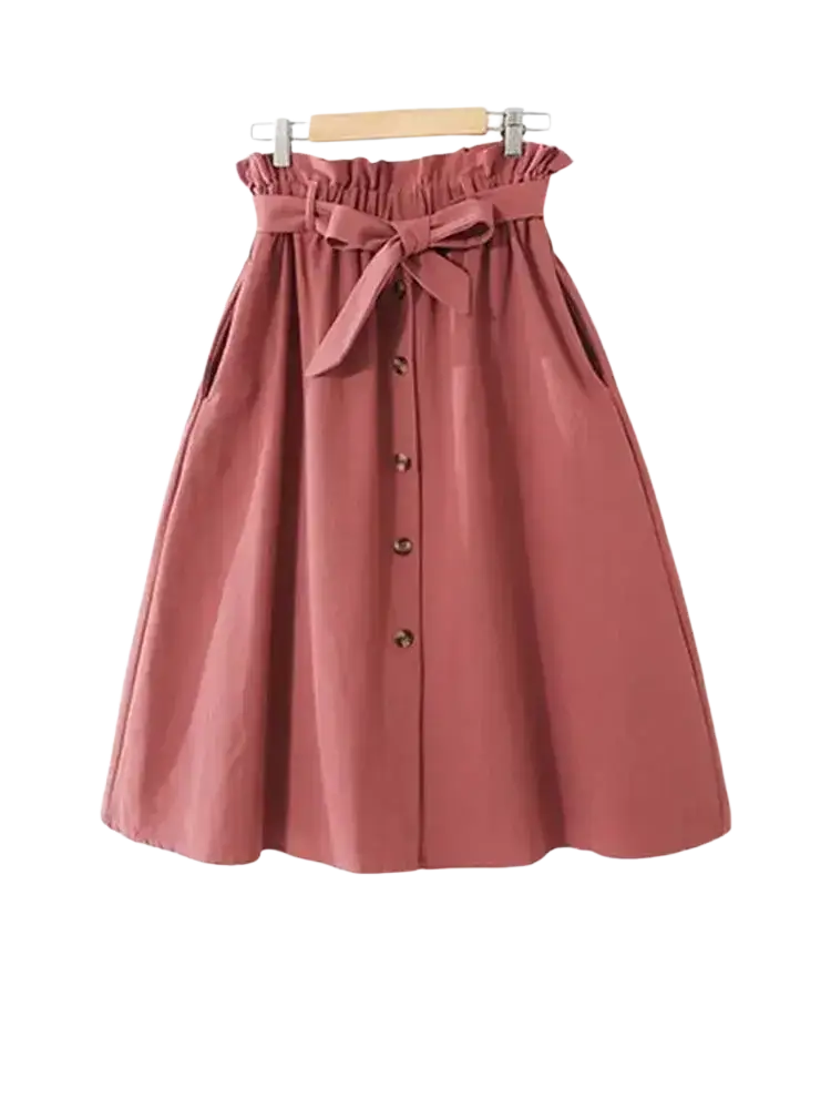 Soft rose-colored cotton midi skirt with high waist gathered waistband and matching bow for casual dresswear