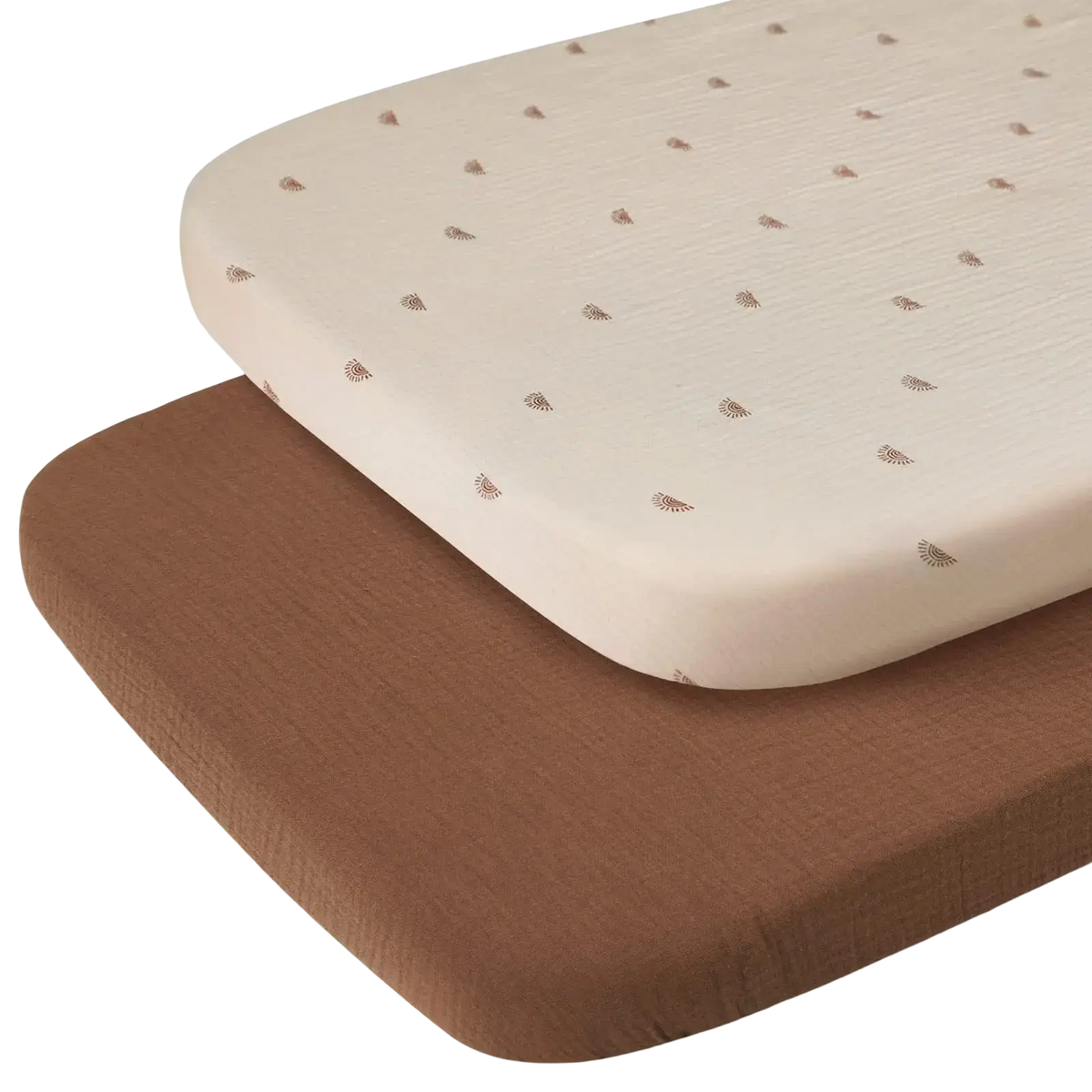 Cotton muslin crib sheet set with cream-colored sheet featuring subtle brown leaf patterns layered over solid brown