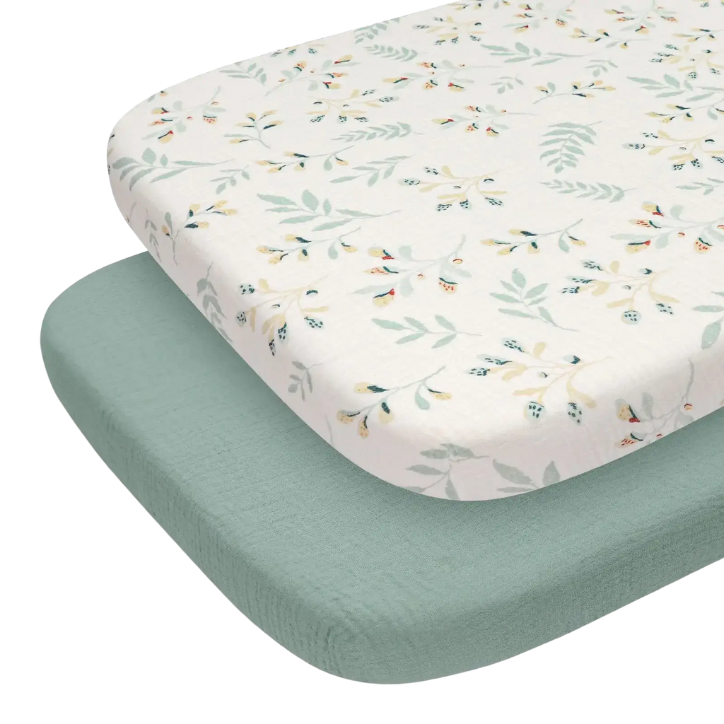 Cotton muslin fitted crib sheet set in soft cream with delicate botanical pattern in muted greens and yellows