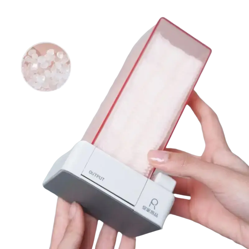 A sleek transparent plastic cotton pad storage box with red rim and white base holding pink salt crystals