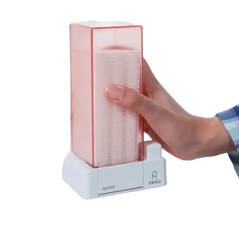 Pink translucent plastic cotton pad dispenser and storage box with white base labeled output for dustproof cotton pad storage