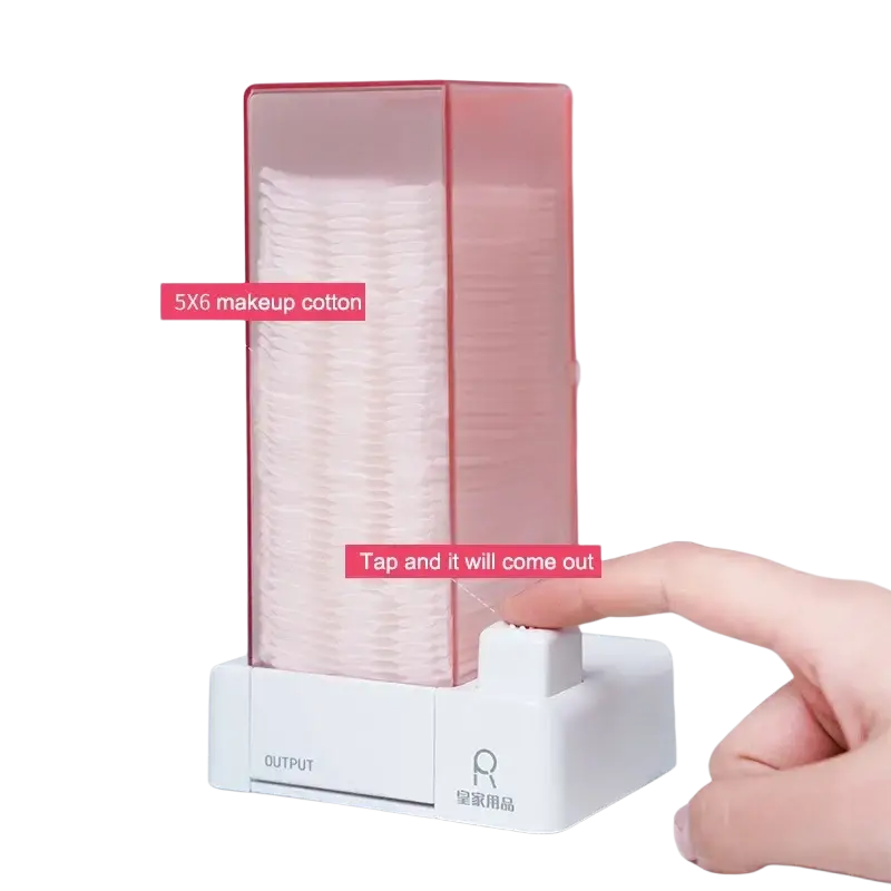 A translucent pink plastic cotton pad dispenser and storage box with white base and dustproof output slot for easy access