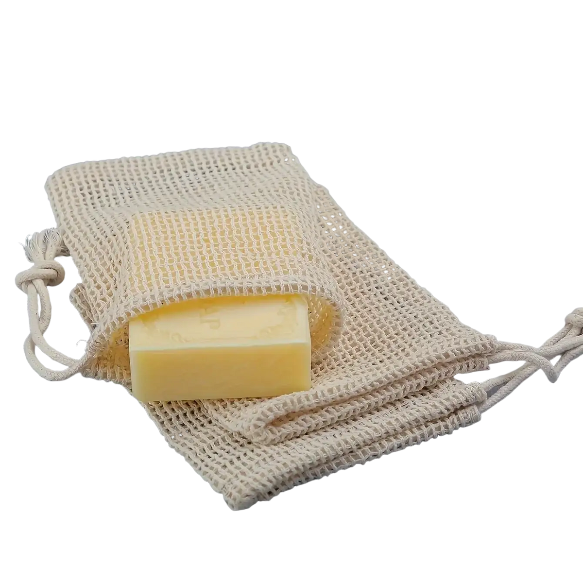 Beige cotton mesh soap saver bag with a pale yellow soap bar inside included in a 3 pack set