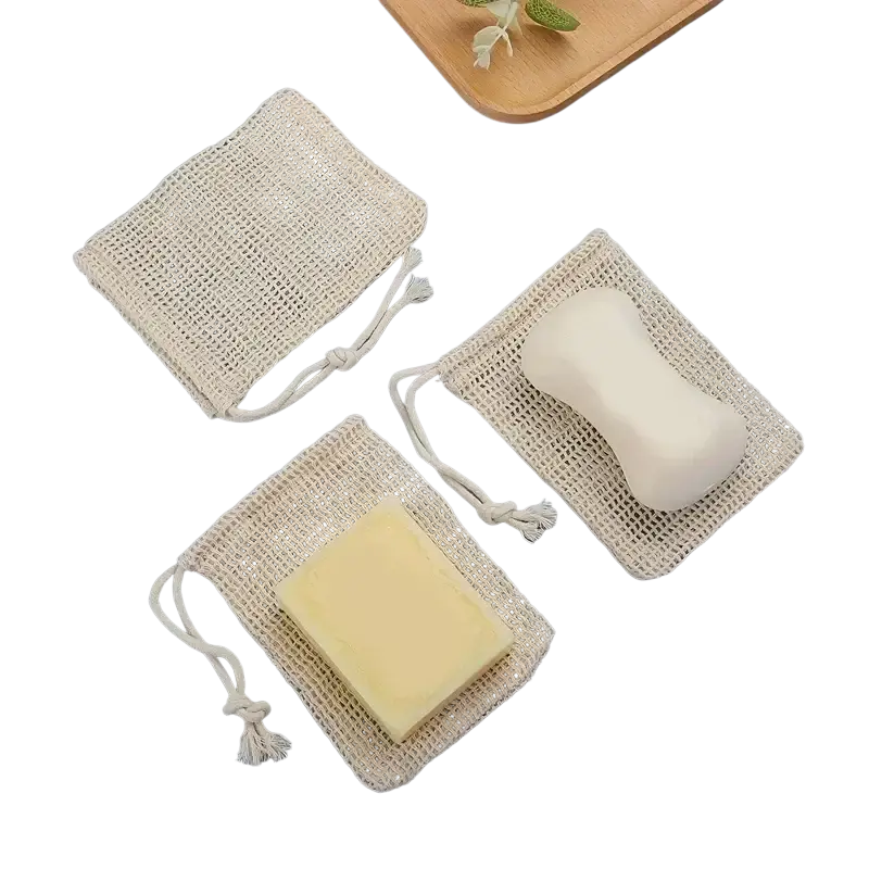 Beige cotton mesh soap saver bags with drawstring closures in a 3 pack for eco friendly soap storage