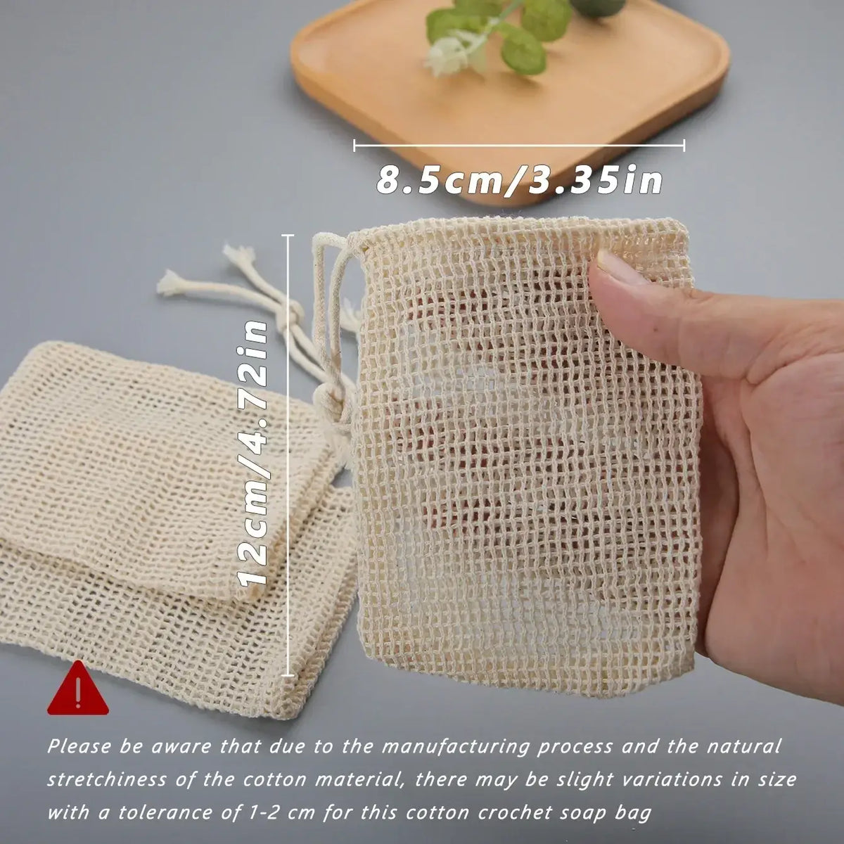 Beige cotton soap saver bag with crochet texture and drawstring closure for exfoliating and soap storage