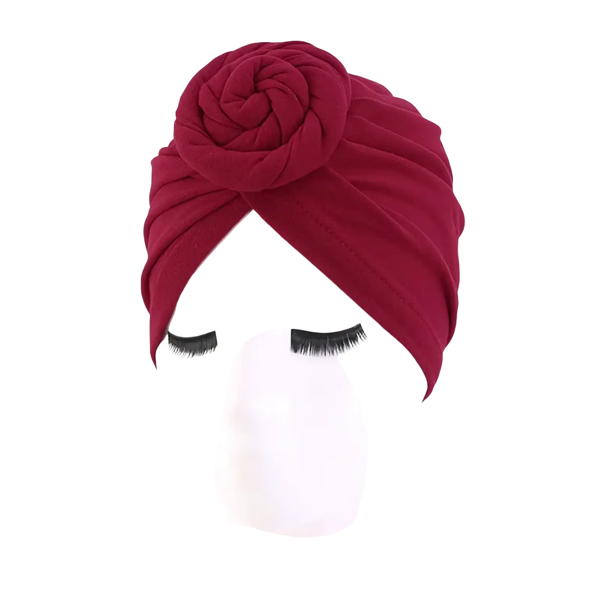 A rich burgundy cotton turban headwrap for women featuring a prominent intricately folded rose knot embellishment