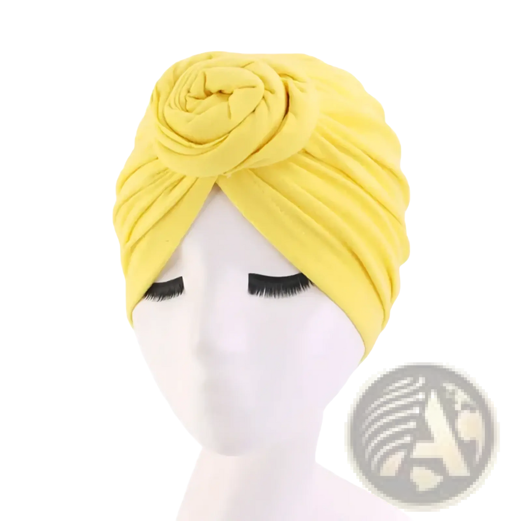 Bright yellow cotton turban headwrap for women with soft texture and decorative rose knot hijab cap design