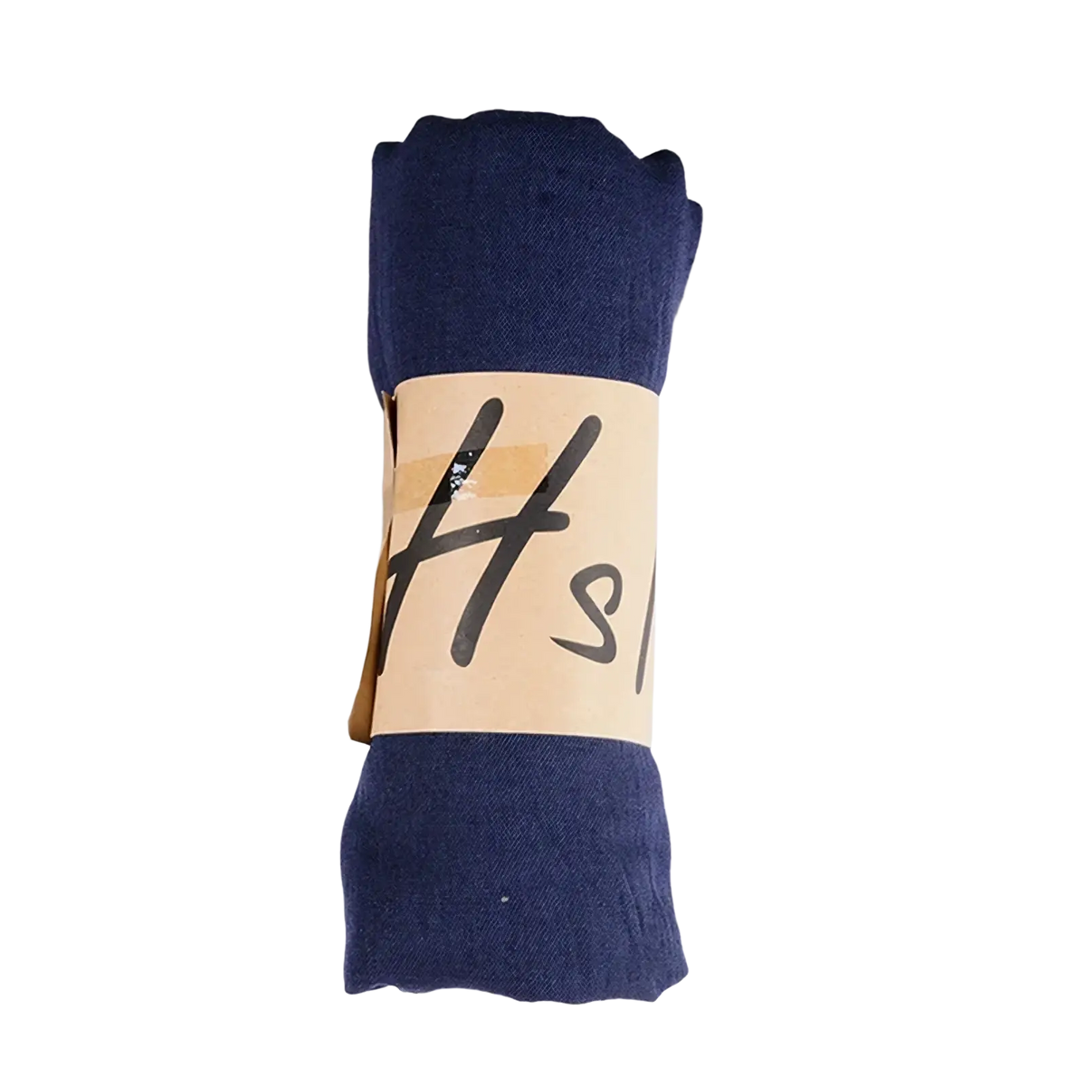 A neatly rolled navy blue cotton winter scarf with a beige paper band featuring black handwritten-style lettering