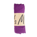 A rolled-up purple cotton winter scarf with a beige label featuring black cursive text for women