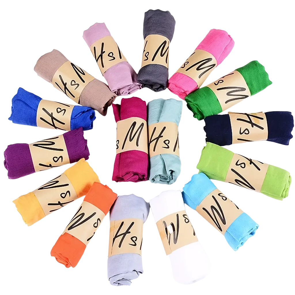 A vibrant array of soft-colored cotton winter scarves for women in pink blue green and orange hues for warmth and style