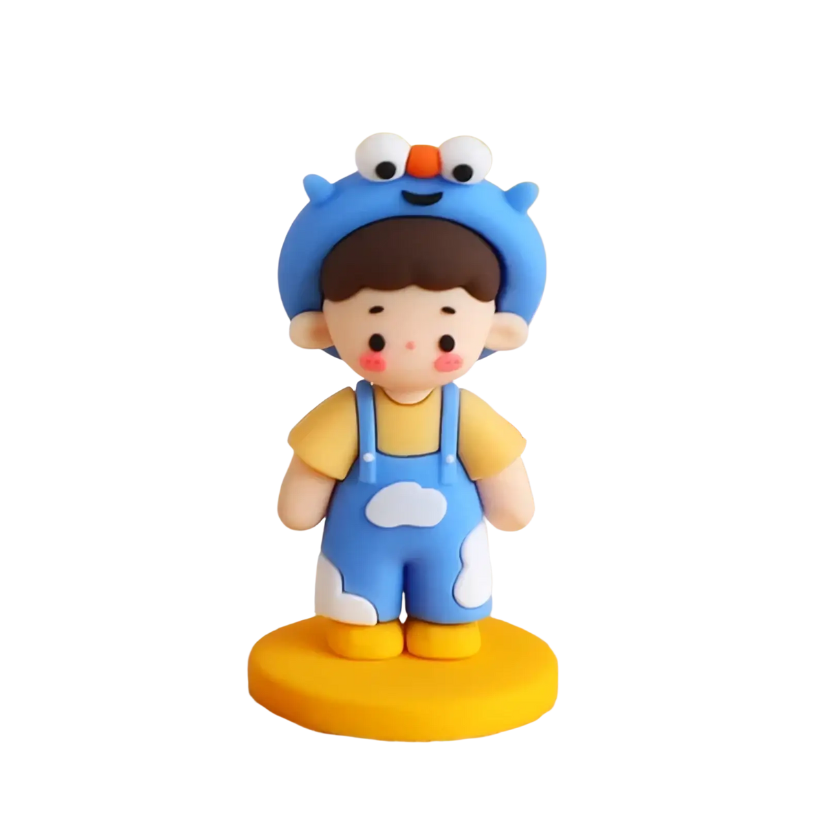 A blue clay pvc figurine boy wearing overalls and hat on a yellow base for couple cake topper valentine anniversary
