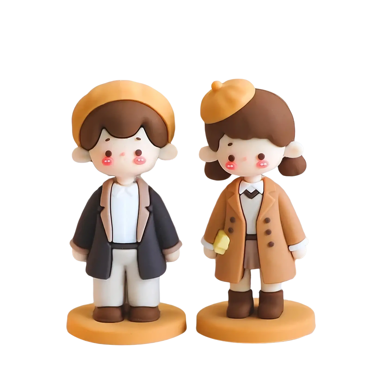 Cute cartoon-style pvc resin couple cake topper of boy and girl in coordinated outfits on orange bases for valentine anniversary
