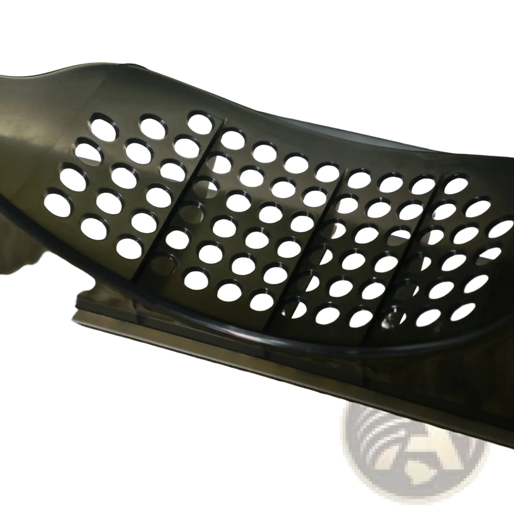 Black perforated plastic scoop resting on light brown wood pellets for covered cat litter box with drawer and mat