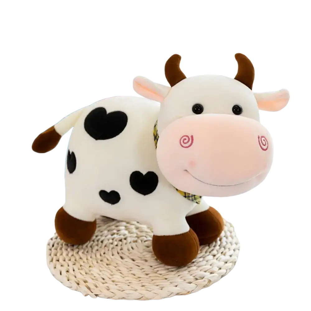 Adorable white cow plush toy with black heart spots, brown horns, pink spiral snout, and yellow plaid collar