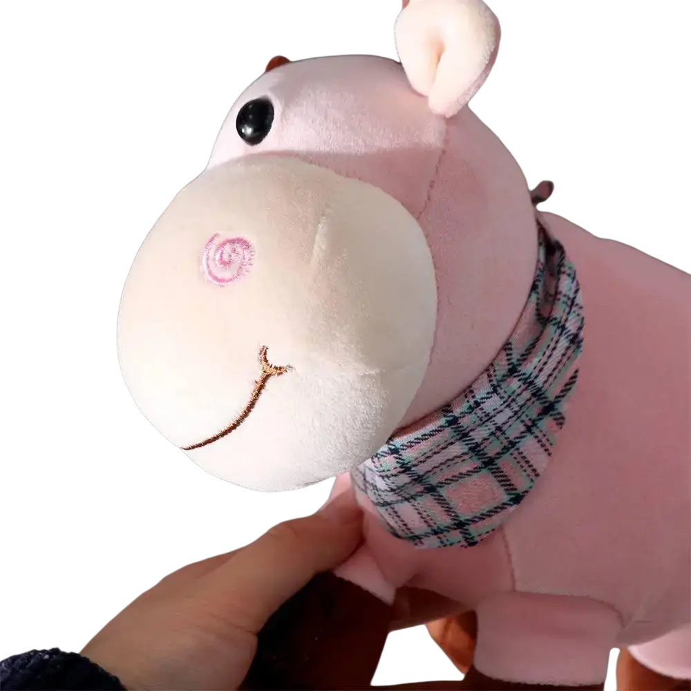 Pink plush hippo toy with white snout black button eye and plaid scarf displayed as cow plush toy soft stuffed animal pillow