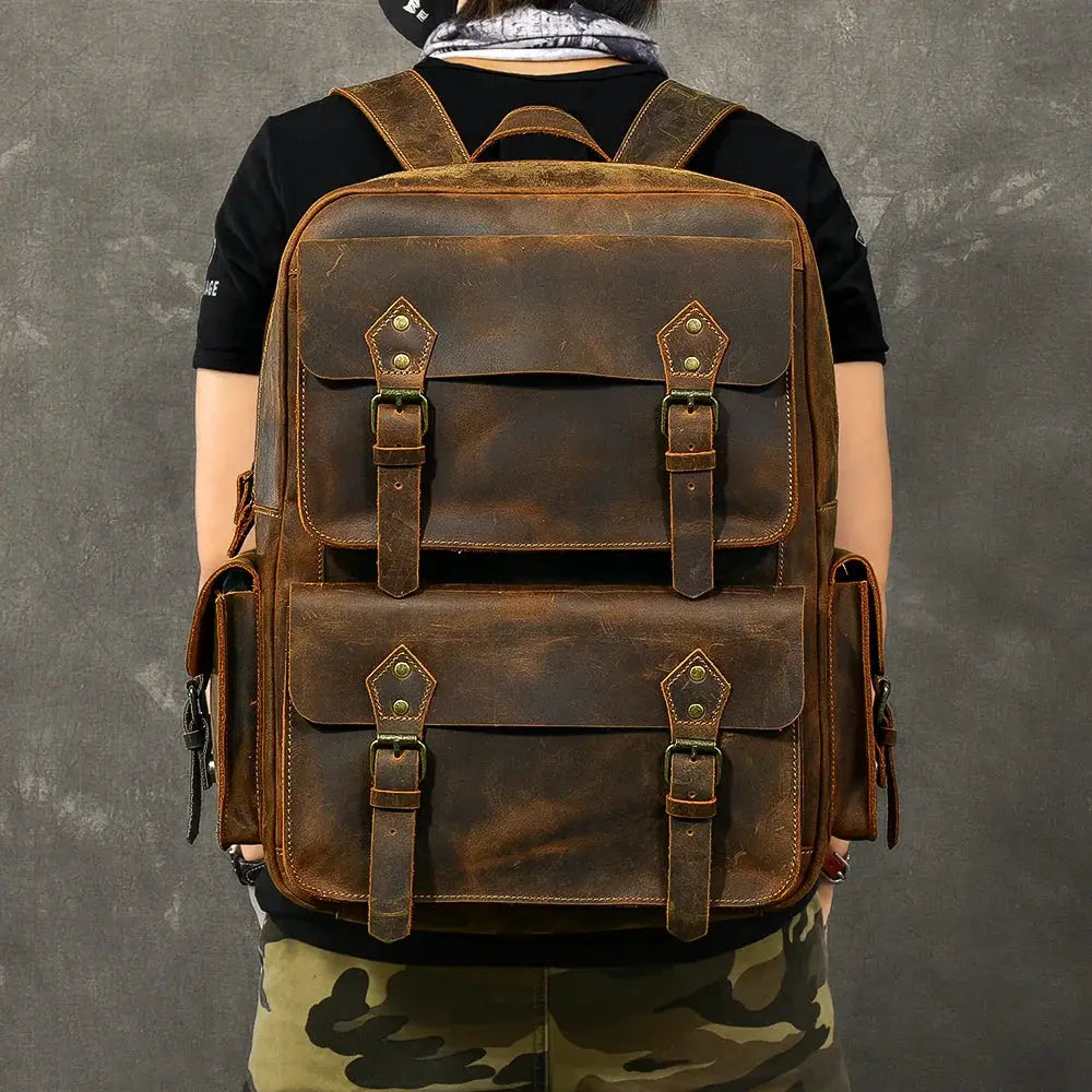 Vintage crazy horse leather adventure backpack in rugged brown with vintage-style flap closures and sturdy straps