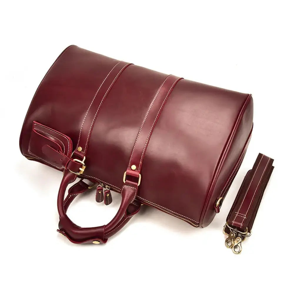 Burgundy crazy horse leather duffel tote bag with rich leather, gold-toned hardware, and contrasting stitching