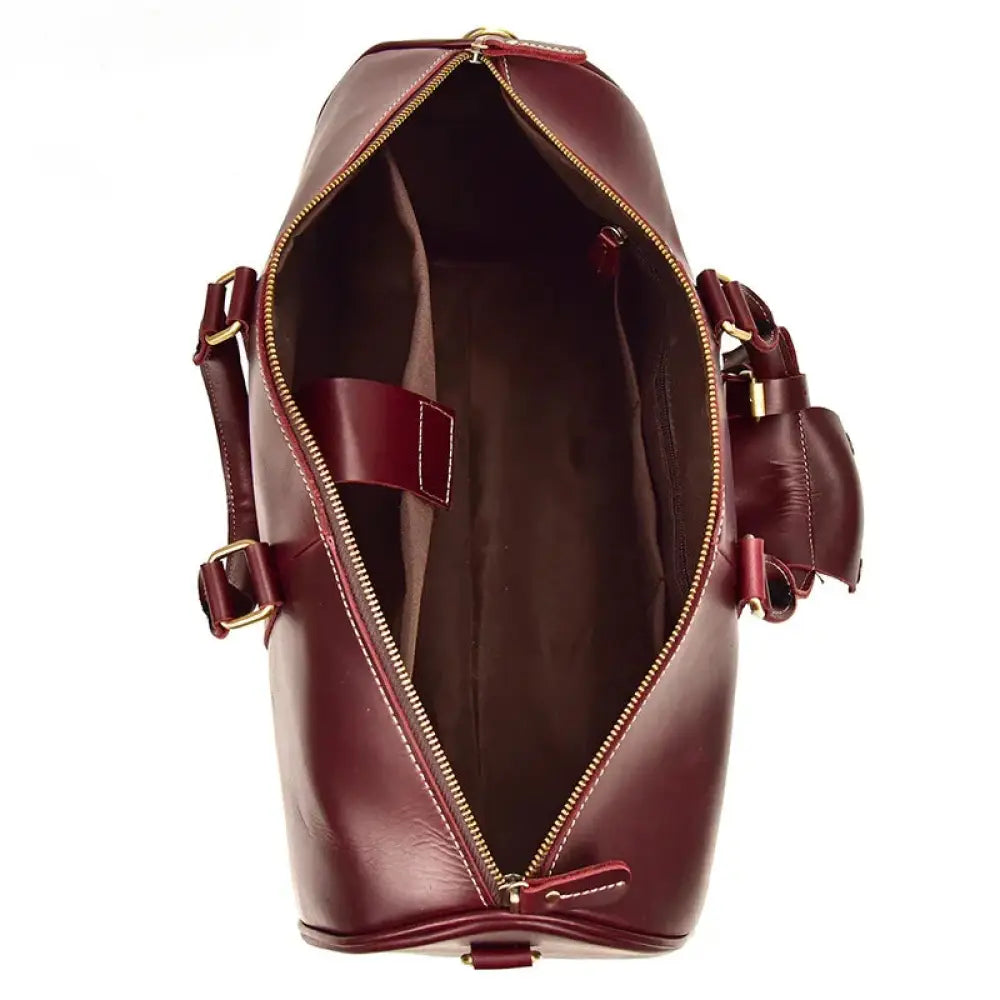 Burgundy crazy horse leather duffel tote bag with rich burgundy leather and gold toned zippers and hardware