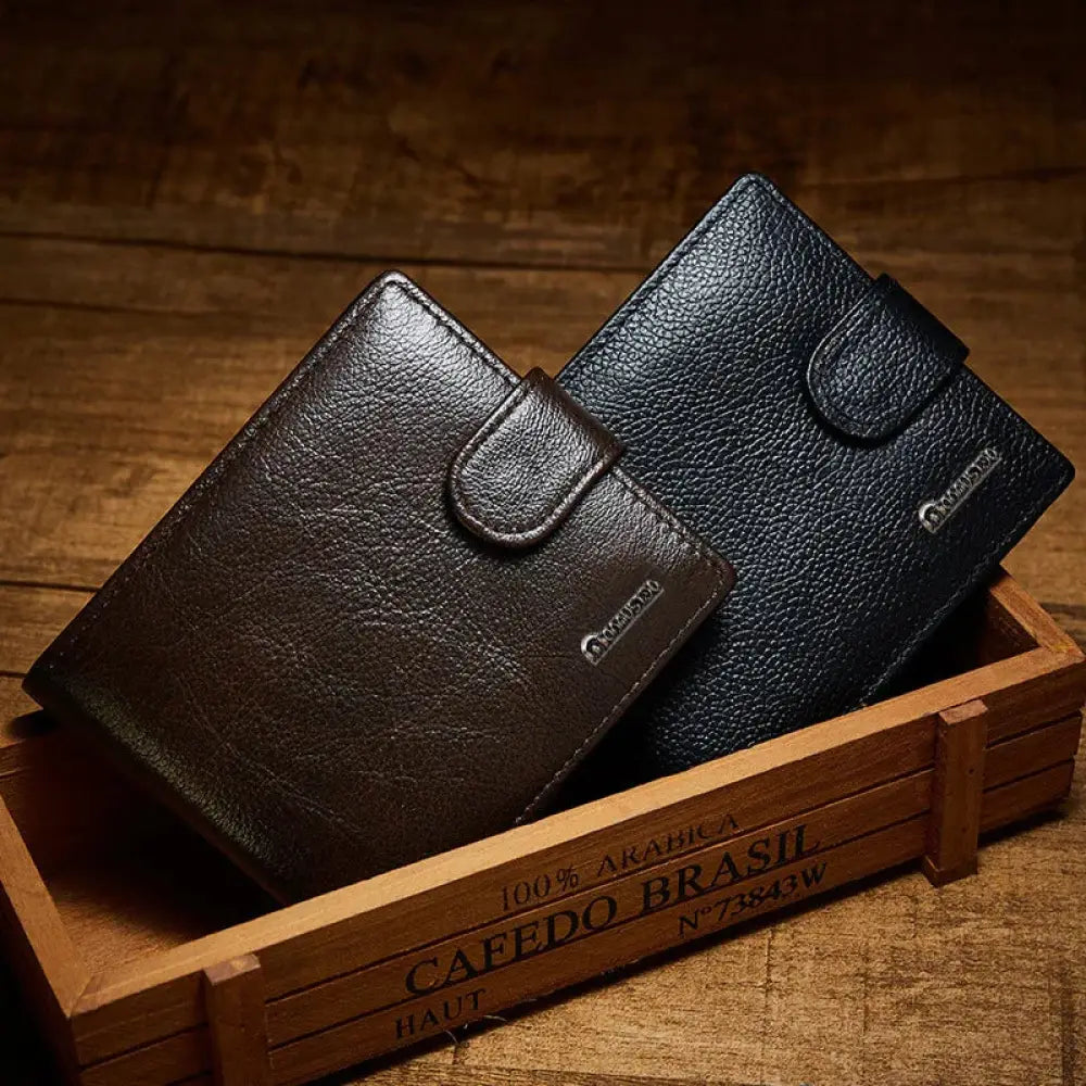 Two vintage crazy horse leather multi slot wallets in dark brown and black with textured surface and metal logo flap closure