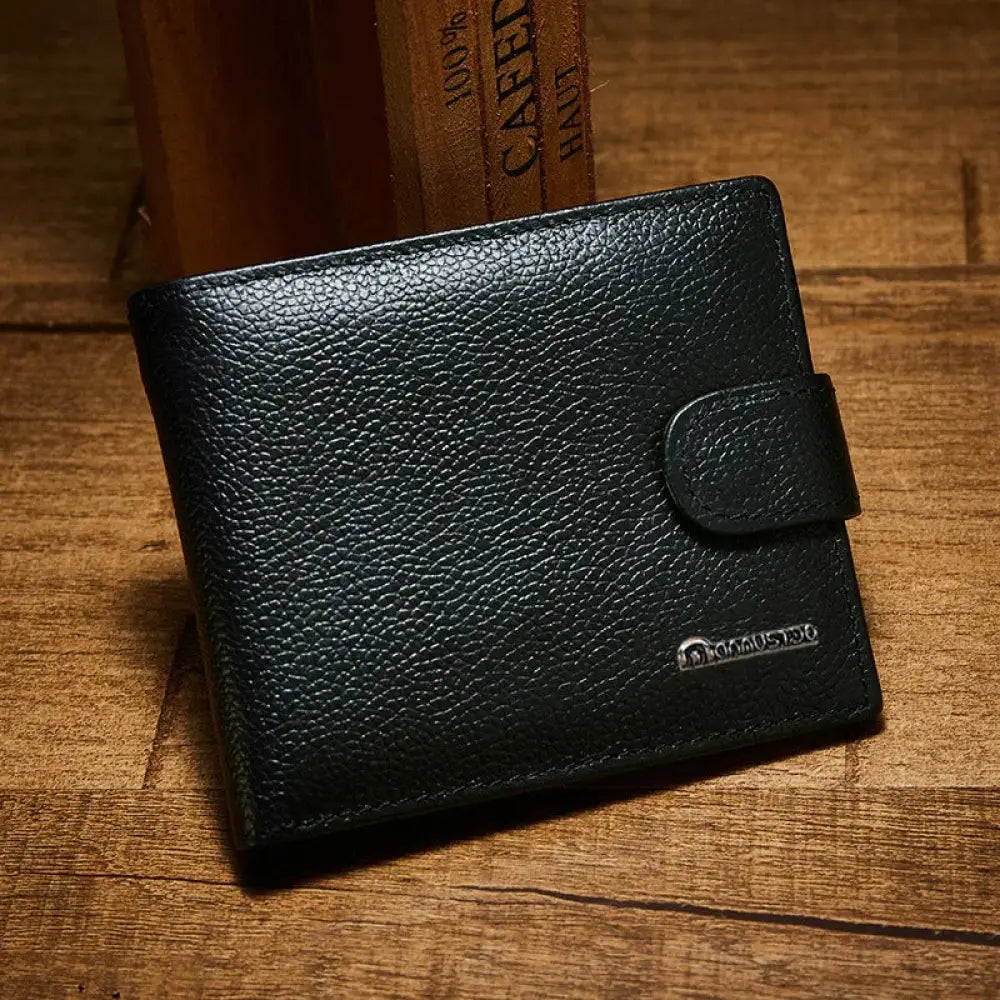 Black textured vintage crazy horse leather wallet with flap closure and embossed brand logo