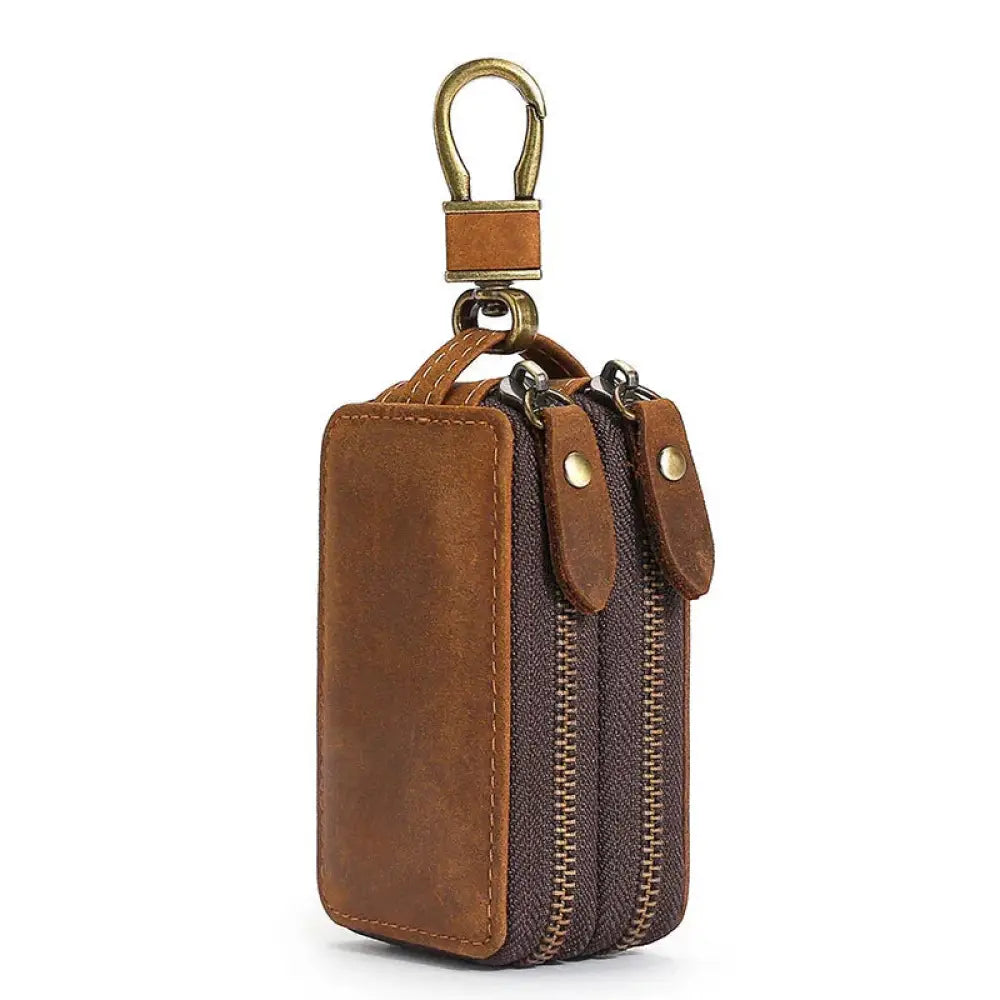 Premium crazy horse leather brown keychain with two zippers and a brass carabiner clip for secure carrying