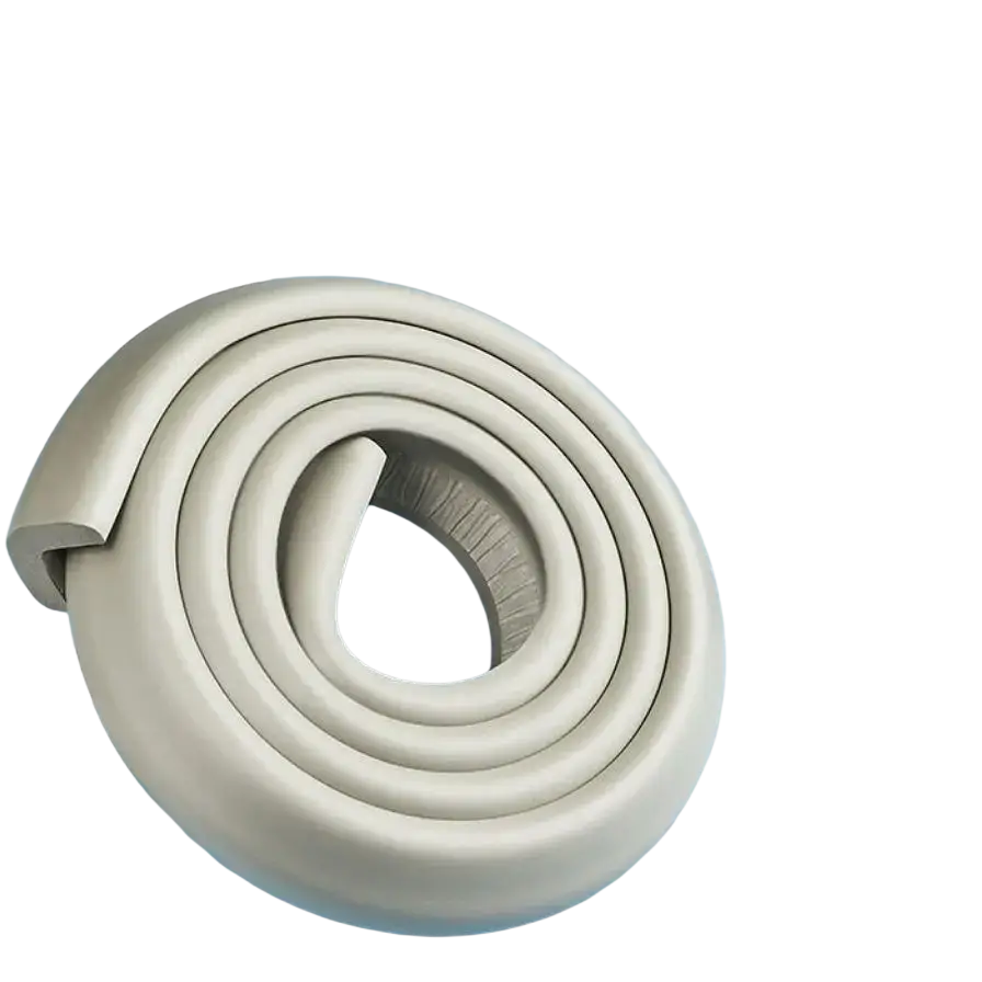 Cream foam table corner protector guard with coiled beige foam bumper and soft rounded profile with textured surface