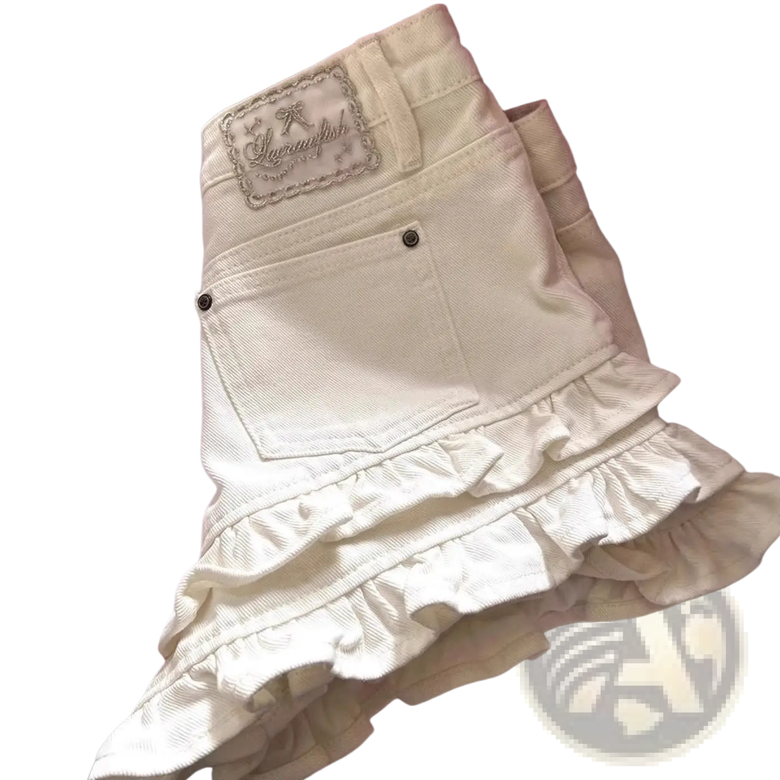 Cream ruffled denim shorts high waist showing back side with cream-colored fabric ruffled hem and embroidered patch