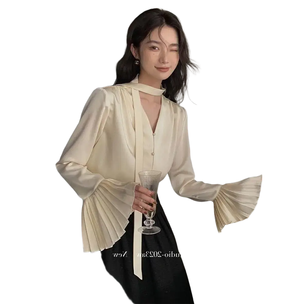 Cream satin blouse with long flared sleeves and pleated cuffs made of smooth satin fabric for elegant wear
