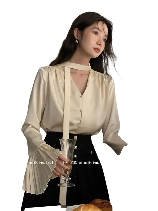 Cream satin blouse long sleeve pleated top with v-neckline button-front closure and flared bell sleeves