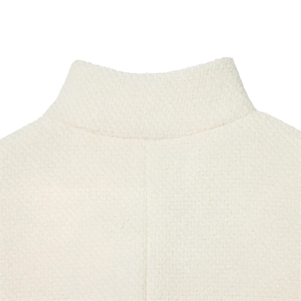 Cream tweed stand collar blazer paired with cream-colored textured knit turtleneck sweater in soft plush fabric