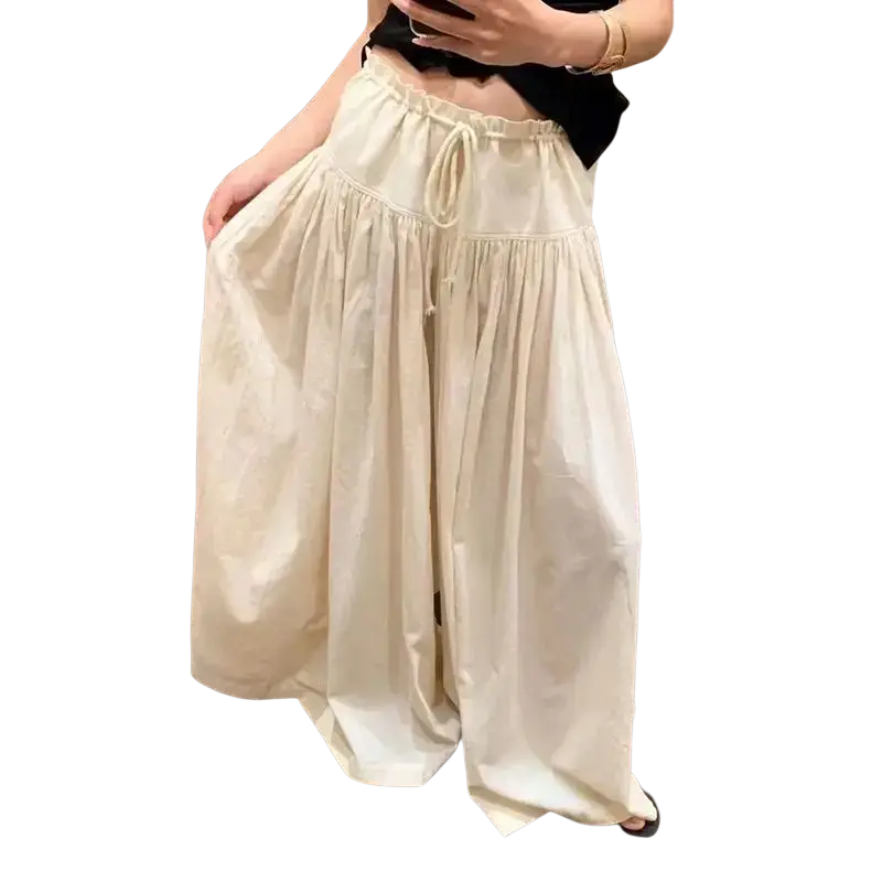 Cream-colored wide leg drawstring pants with high waist and soft pleated detailing for comfortable wear