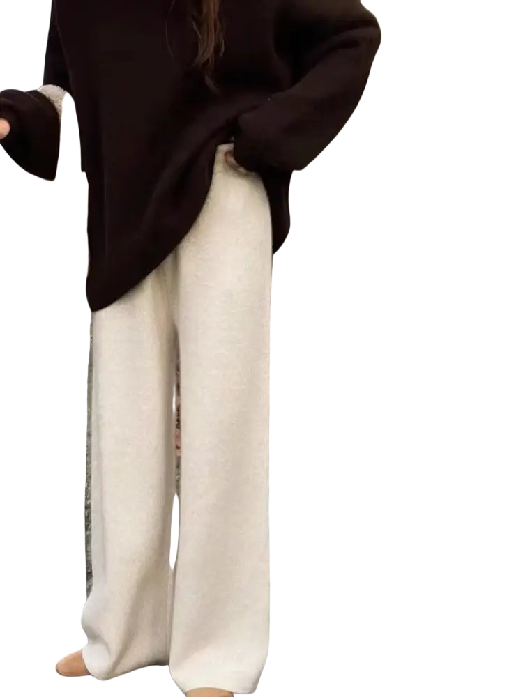 Cream wool wide leg knit pants in cream color featuring soft textured knit and wide leg design