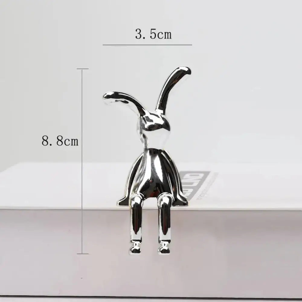 Minimalist silver metallic rabbit figurine with sleek design and elongated ears for elegant home decor